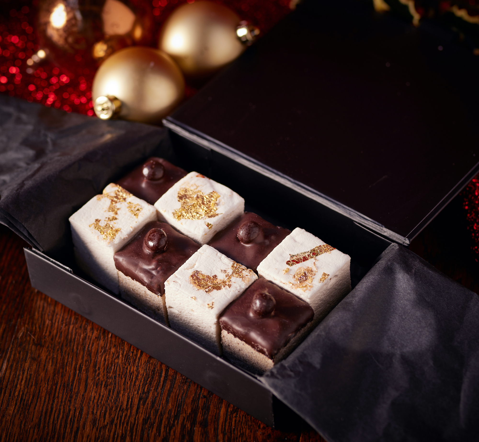 Christmas chocolate marshmallows on a table with baubles