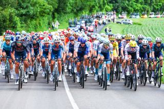 The peloton pictured in action during stage 5 of the 2024 Tour de France cycling race, from Saint-Jean-de-Maurienne to Saint-Vulbas, France (177,4 km) on Wednesday 03 July 2024. The 111th edition of the Tour de France starts on Saturday 29 June and will finish in Nice, France on 21 July. BELGA PHOTO POOL LUCA BETTINI (Photo by POOL LUCA BETTINI / BELGA MAG / Belga via AFP) (Photo by POOL LUCA BETTINI/BELGA MAG/AFP via Getty Images)