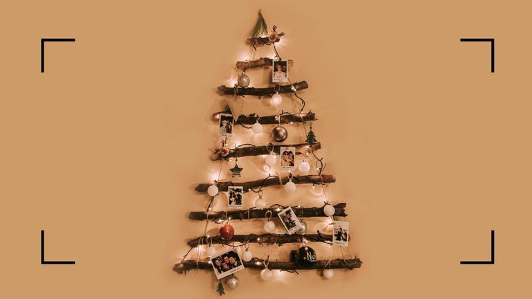 A hanging wall ladder pictured against an orange background as an example of Christmas tree alternatives