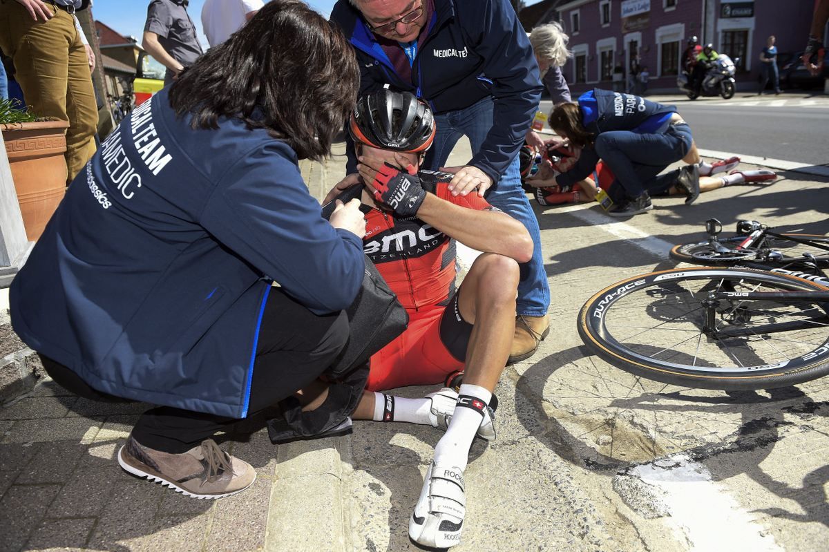 The medics attend to Greg Van Avermaet (BMC) after the crash