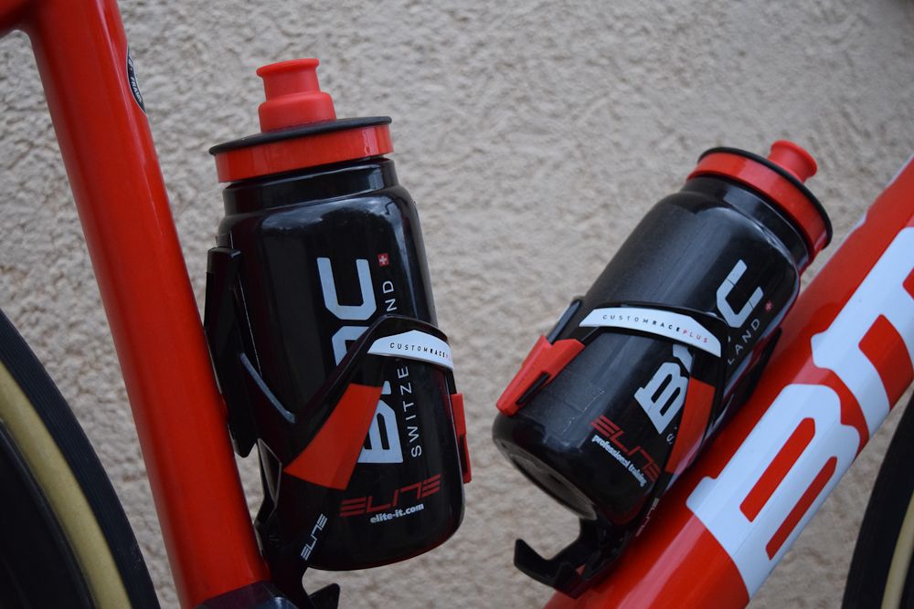 BMC Racing use colour coordinated Elite bottle cages and team bidons