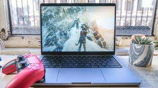 The MacBook Pro 2021 (14-inch) with Rise of the Tomb Raider playing