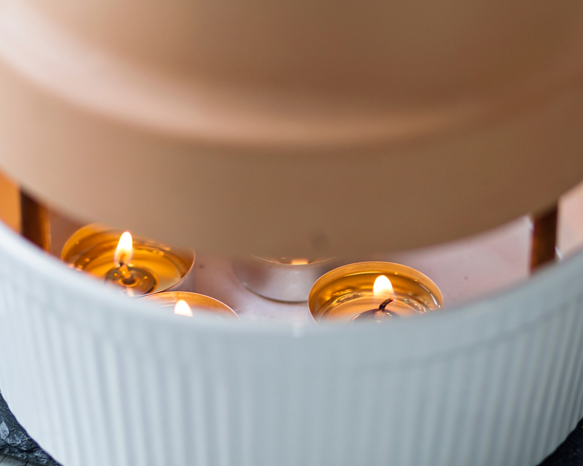 candles under terracotta pot