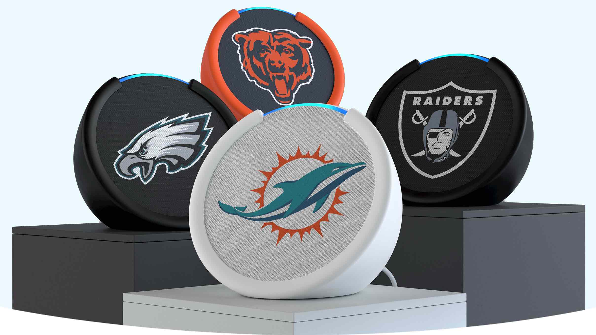 Four Amazon Echo Pops with the NFL team themed accessories