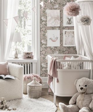 Pink and grey framed wall art in nursery by Poster store