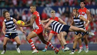 Lance Franklin of the Swans is tackled during the round two AFL match between the Sydney Swans and the Geelong Cats