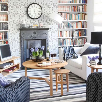 living room with sofa coffee table and fireplace