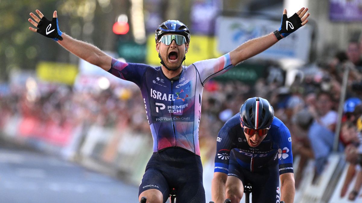 Riley Sheehan of the United States celebrates as he crosses the line first at the Paris–Tours race.