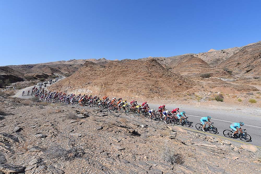 The riders pass through desert landscape of OMan