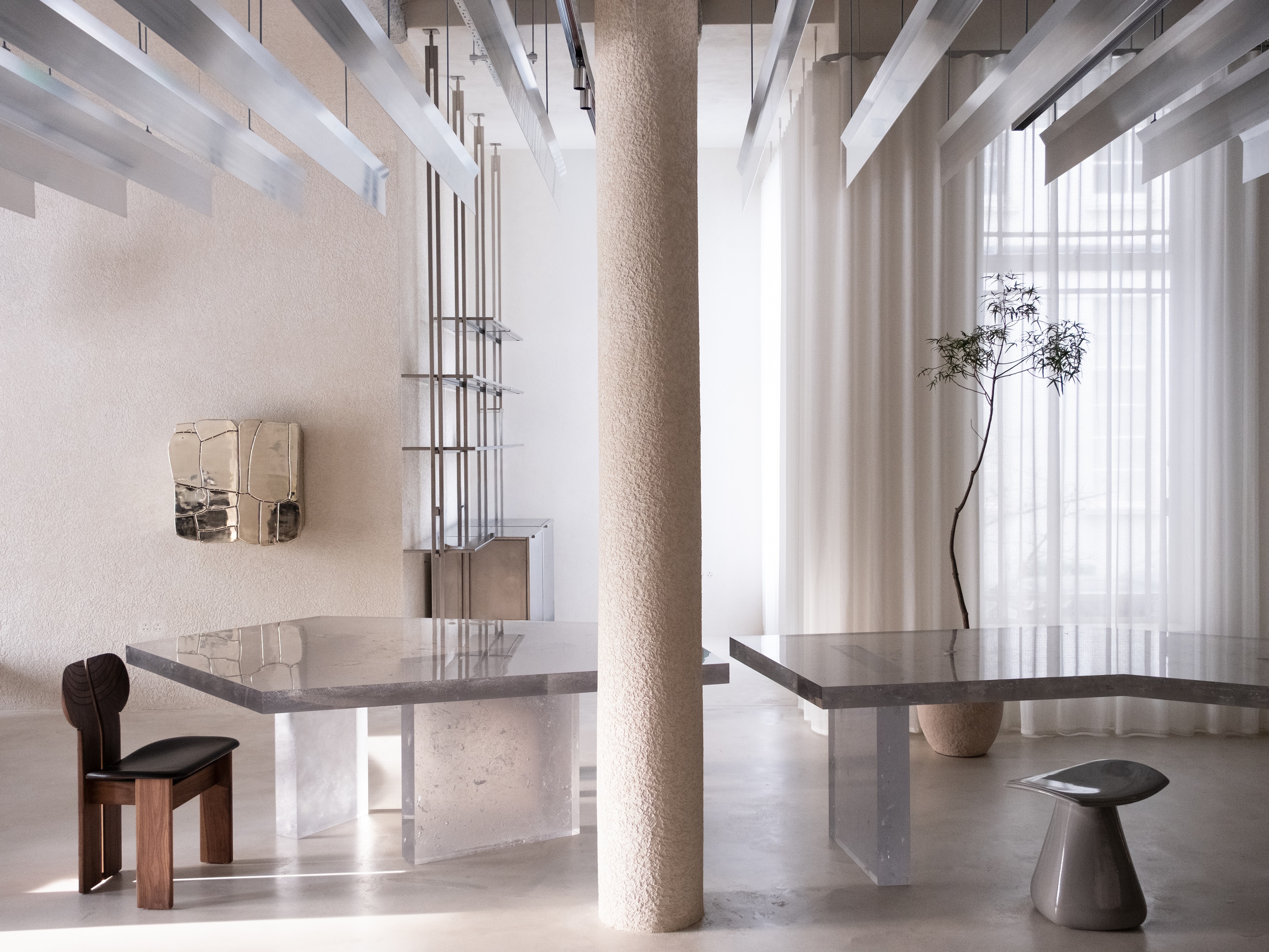 interior of new monologue london showroom with resin translucent tables