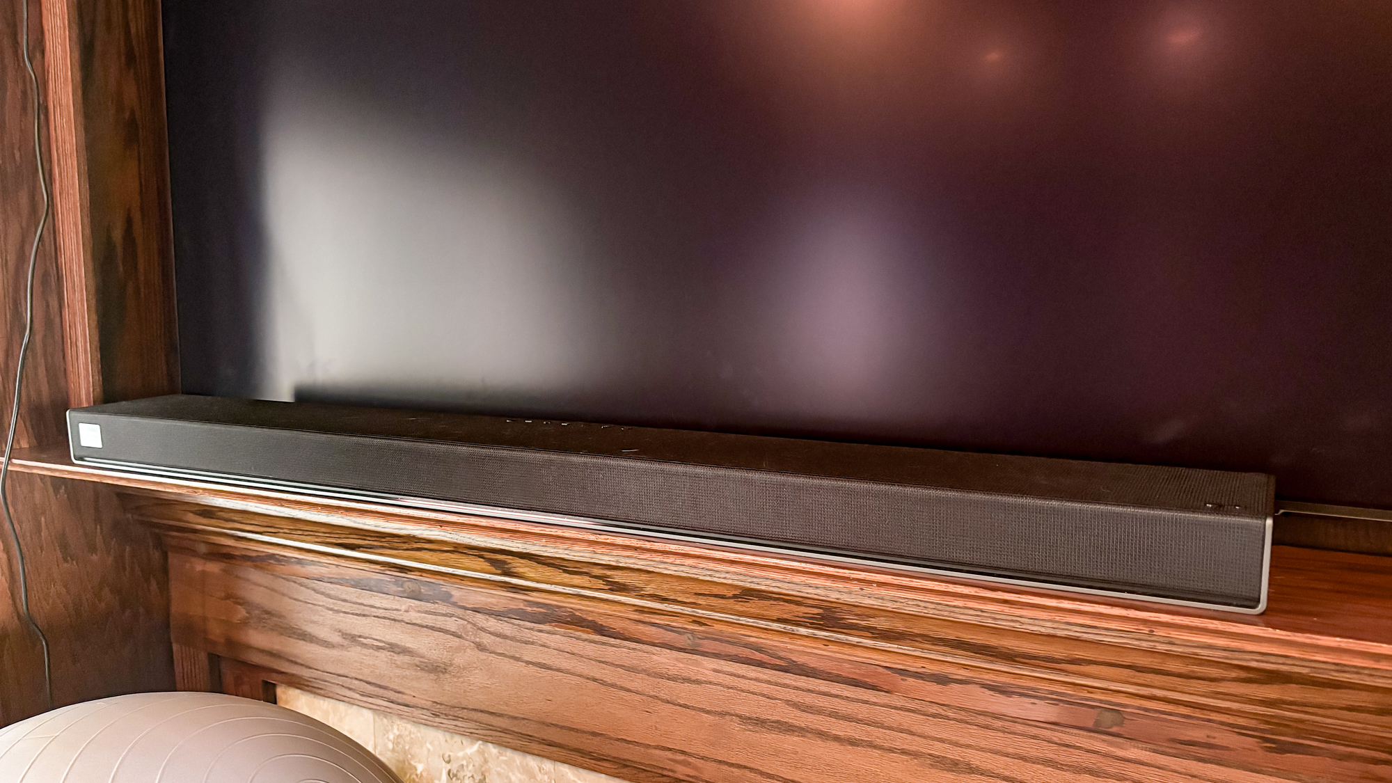 LG Sound Suite H7 Soundbar on a TV stand