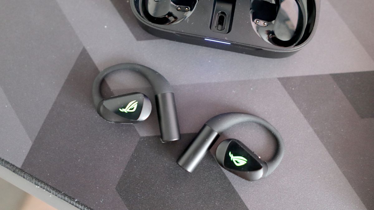 Asus ROG Cetra Open earbuds on a deskmat.