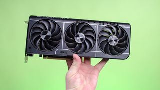 A masculine hand holding the Nvidia GeForce RTX 5070 Ti