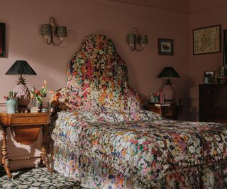 Pink bedroom with single bed covered in a floral print