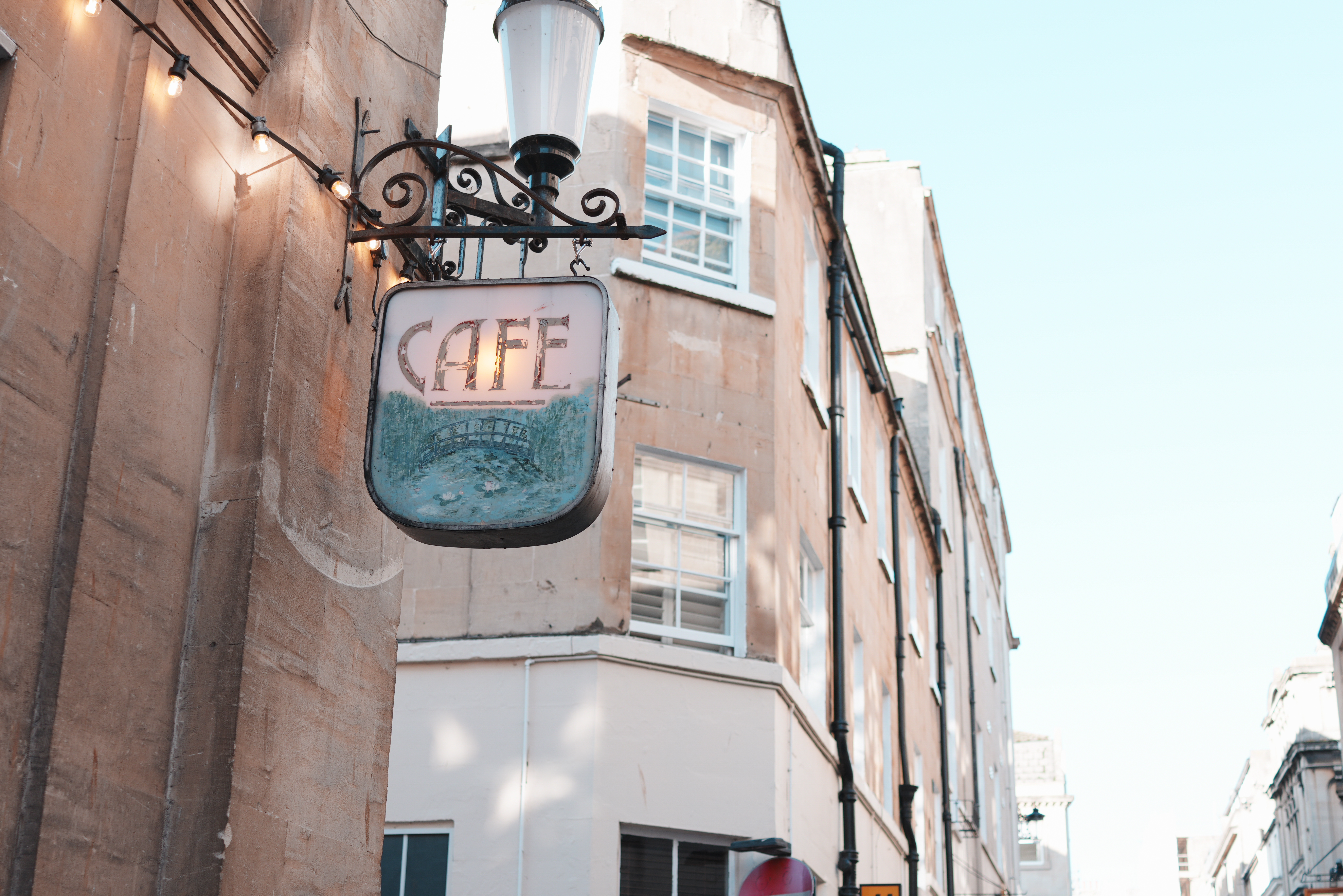 A photo of a cafe sign on a wall