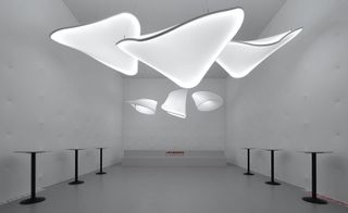 Large white light displays hanging from the ceiling