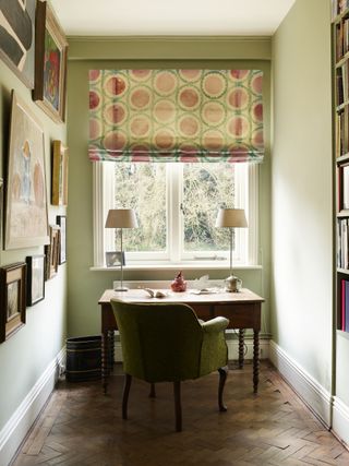 Home office with a Roman blind in abstract fabric