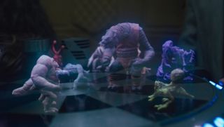 Holographic creatures battle on a chessboard