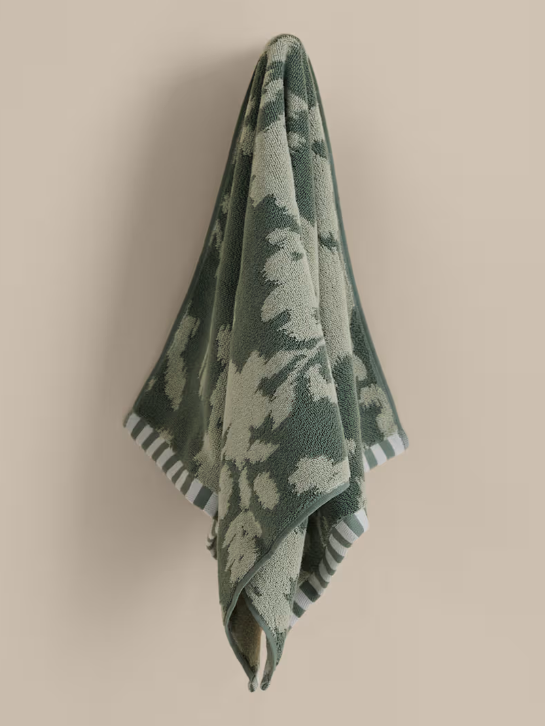 A pure cotton green floral towel from M&amp;amp;S