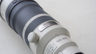A picture of the Sony 100-400mm f/4.5 GM lens from above, showing the lens's name plate.