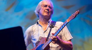 Jim Weider stands in front of a music stand as he plays his Telecaster onstage with the band, celebrating 40 years of The Last Waltz.