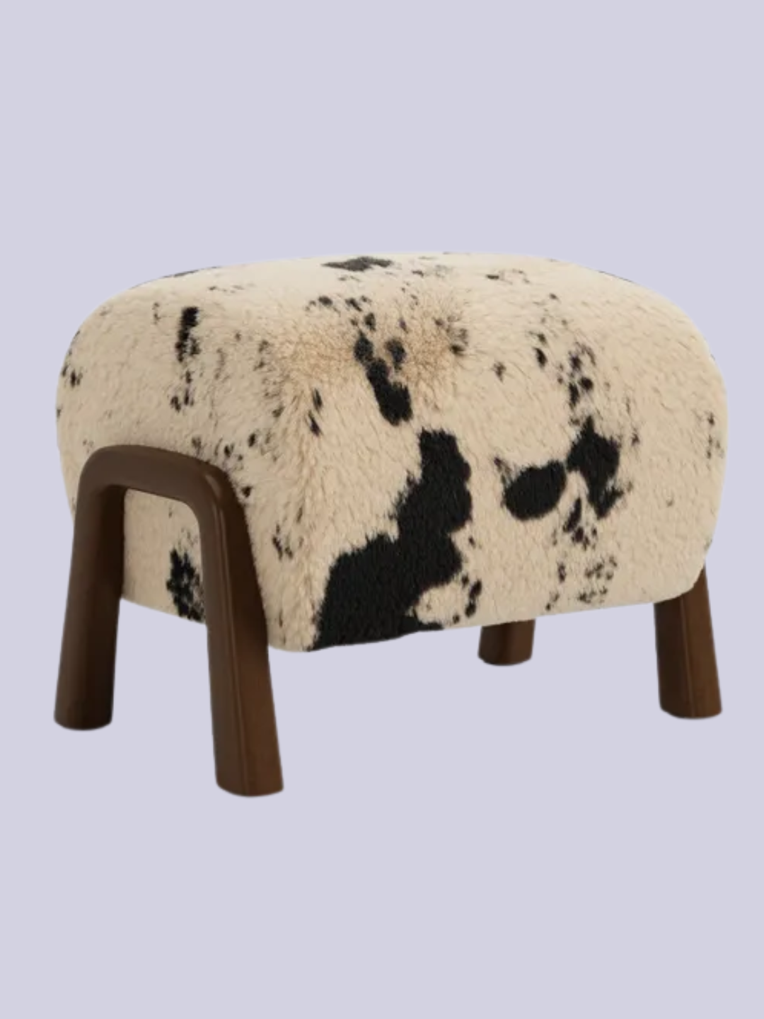 A cow print footstool