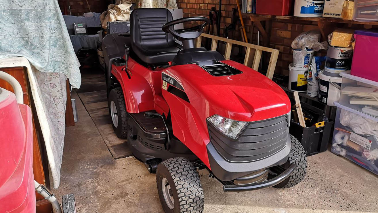 Mountfield 1330M ride on a lawn mower stored in the garage
