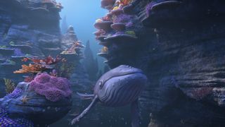 The Snail and the Whale swim through a coral reef