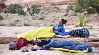 sleeping pad vs air mattress: woman lying on sleeping pad