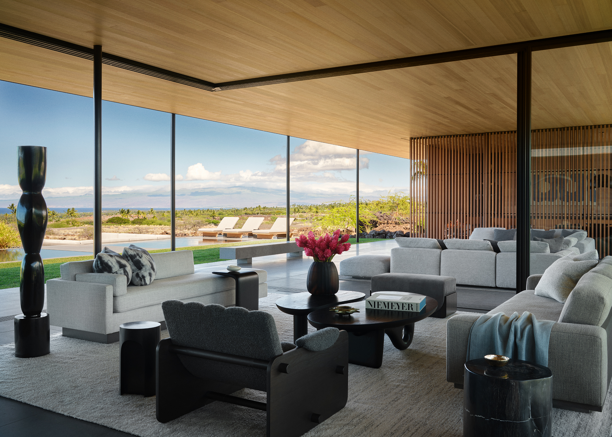 Hawaii house by oslon kundig and leverone design by the sea, tall ceilings, contemporary spaces and art work, and lots of glazing