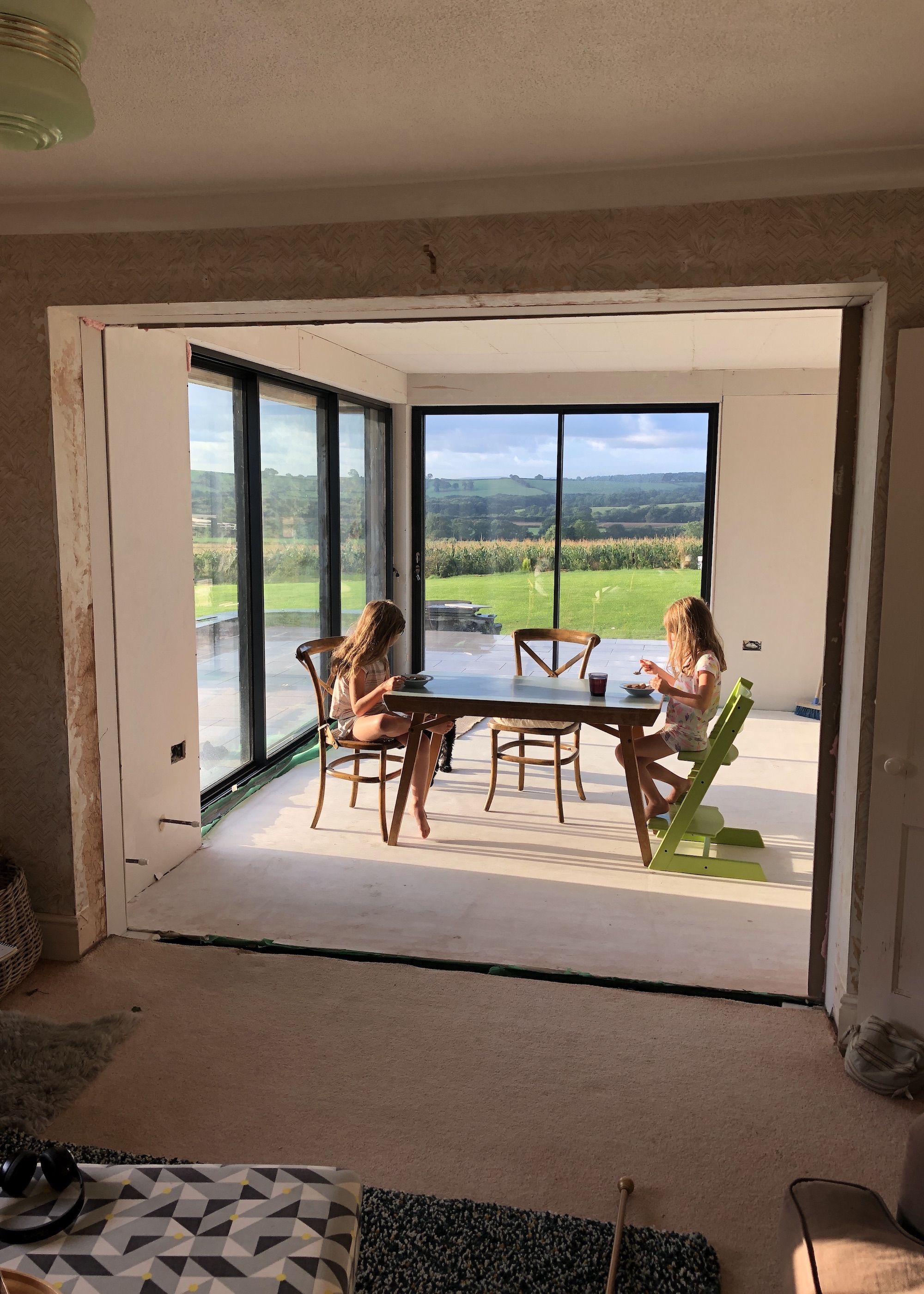 children eating breakfast in a building site