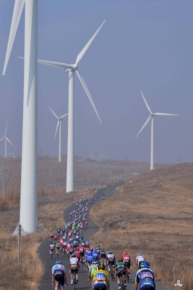 The peloton wind their was through the Chinese countryside