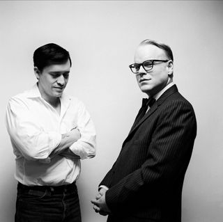 philip seymour hoffman as truman capote wearing a suit and glasses in the movie