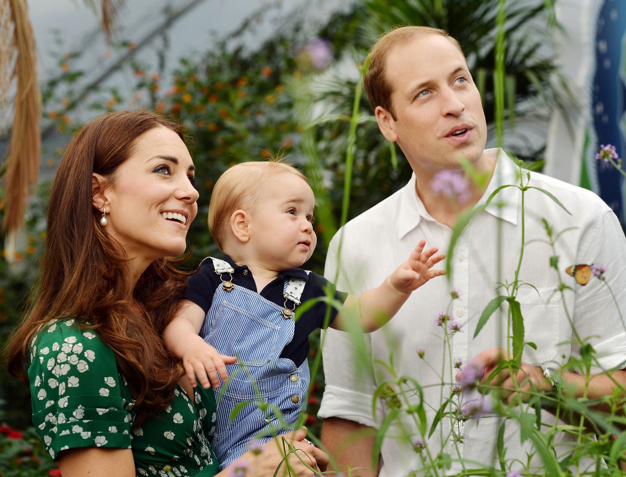 Duchess of Cambridge holds Prince George as he and Prince William, Duke of Cambridge's look on while visiting the Sensational Butterflies exhibition at the Natural History Museum