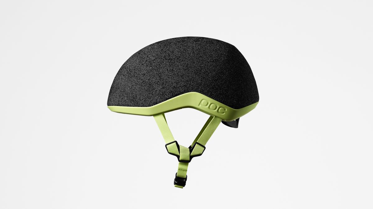 A grey and green commuter helmet from the left side