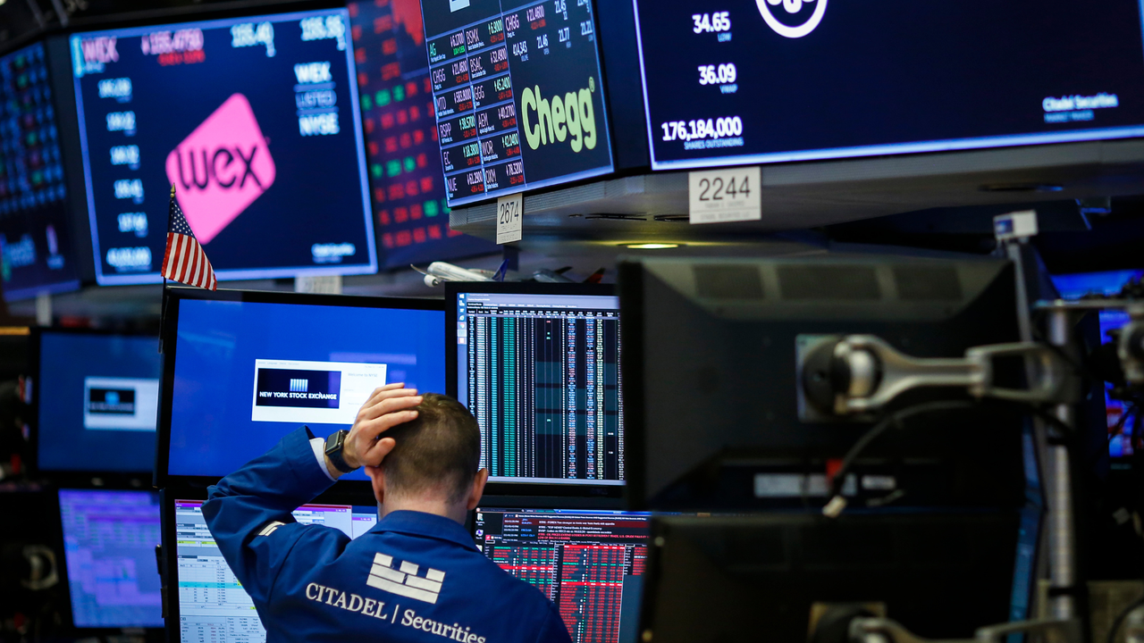  A trader works at his desk on the floor of the New York Stock Exchange 