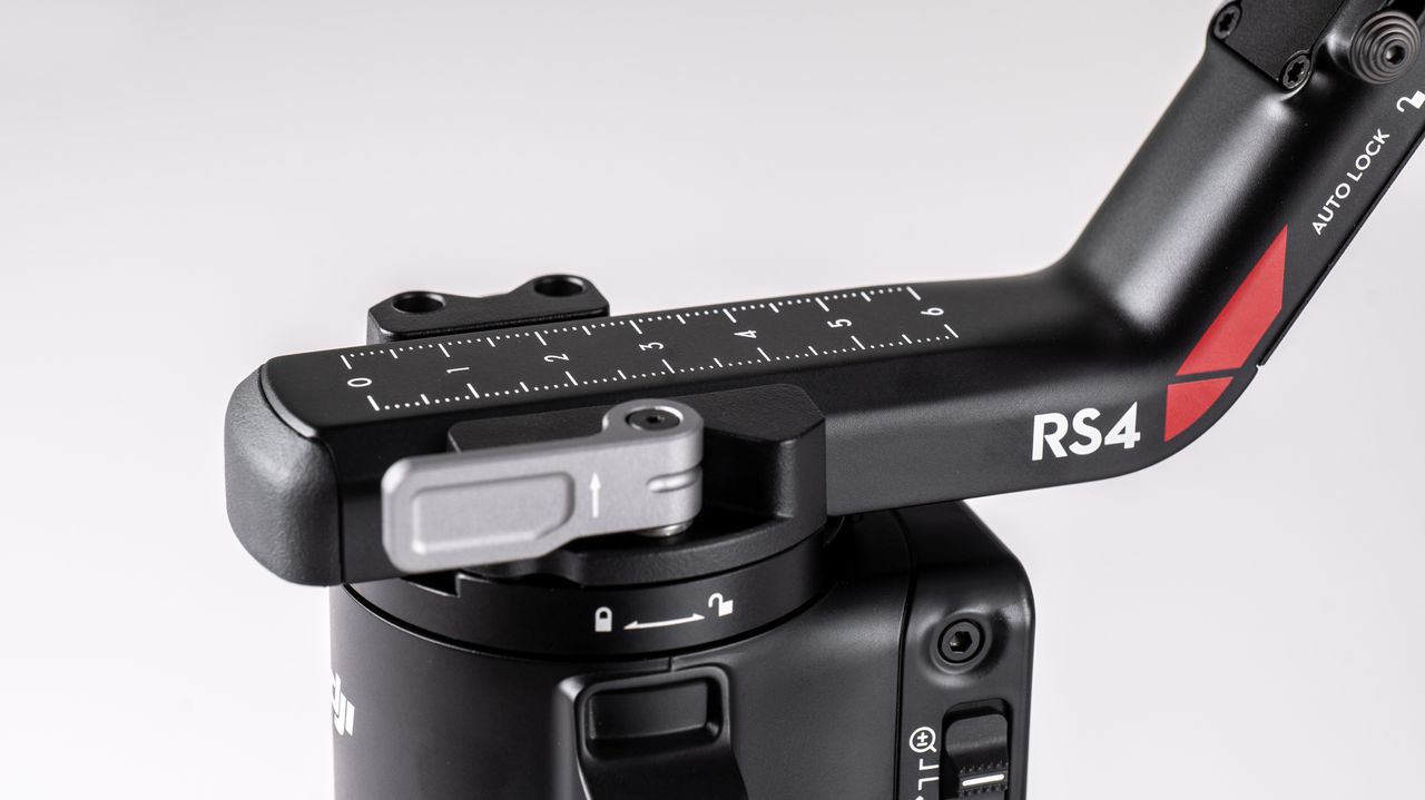 Closeup of DJI RS 4 gimbal balance on a off-white background