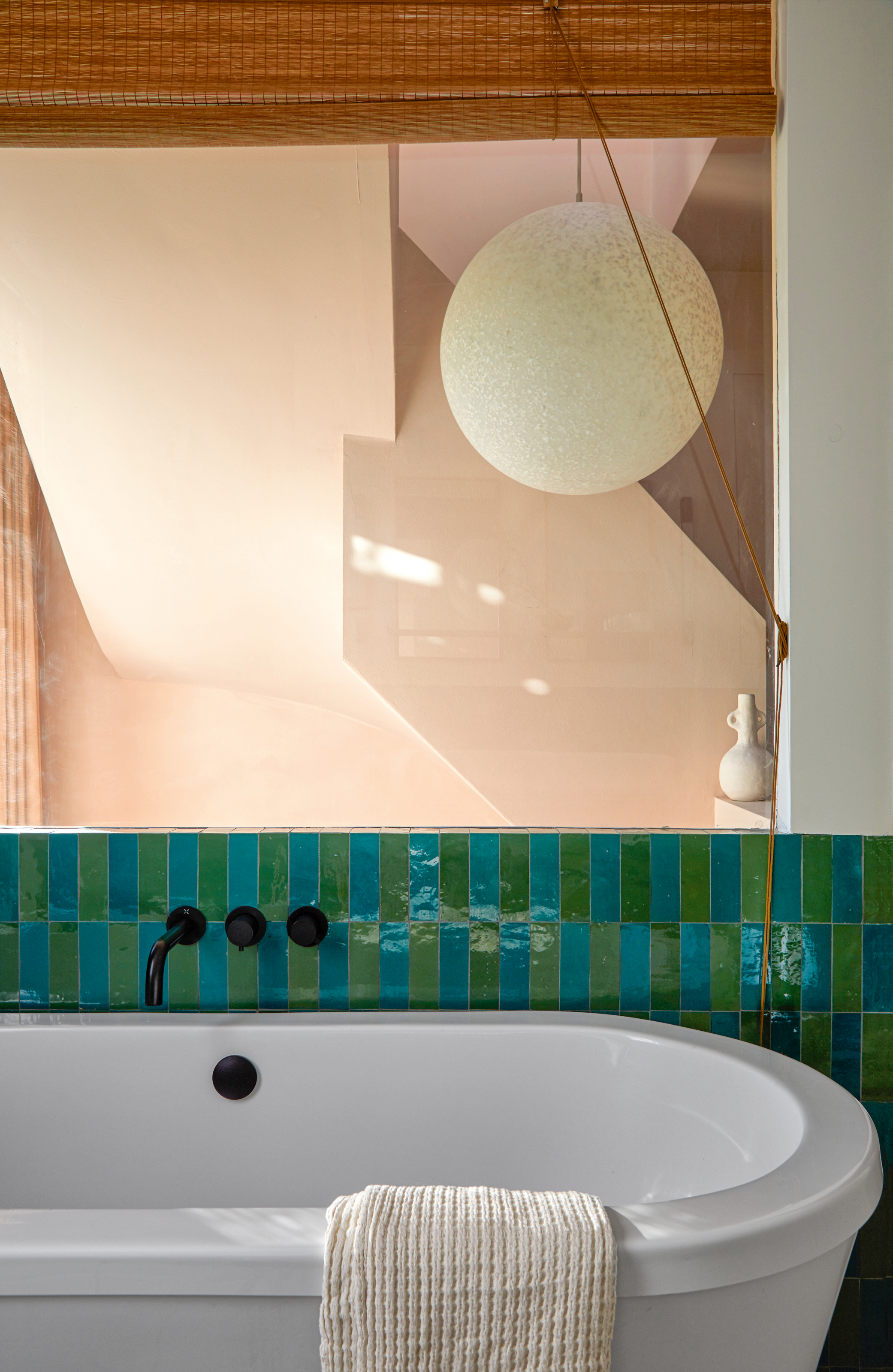 Bathroom with green and blue metro tiles