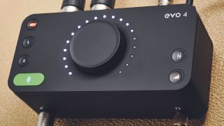 An Audient Evo 4 audio interface on top of a tweed guitar amp