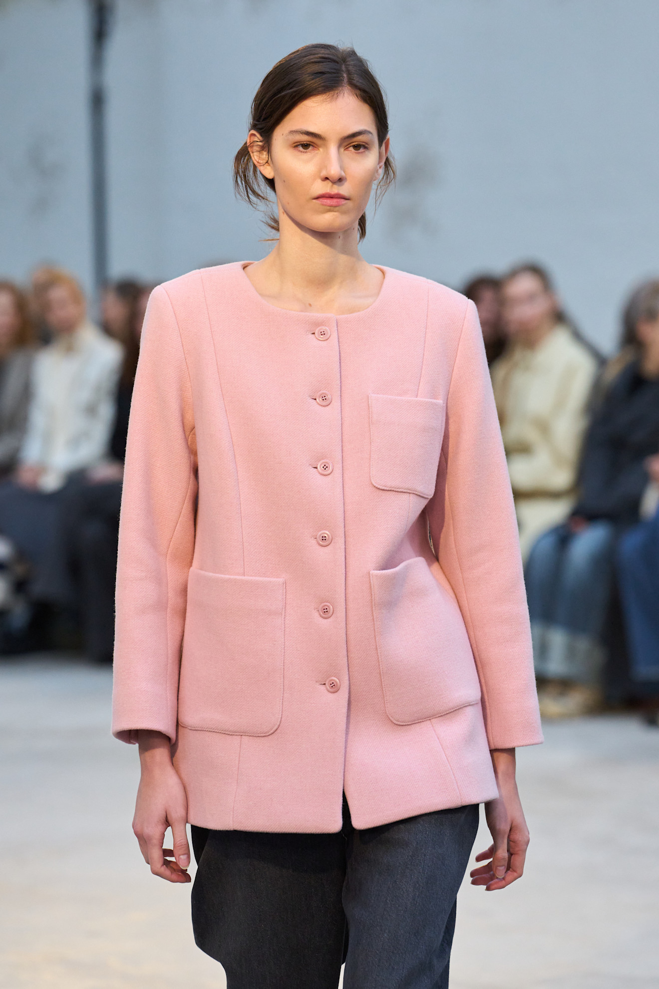 Model wearing pastel pink dress during Skall Studio fall/winter 2025 show.