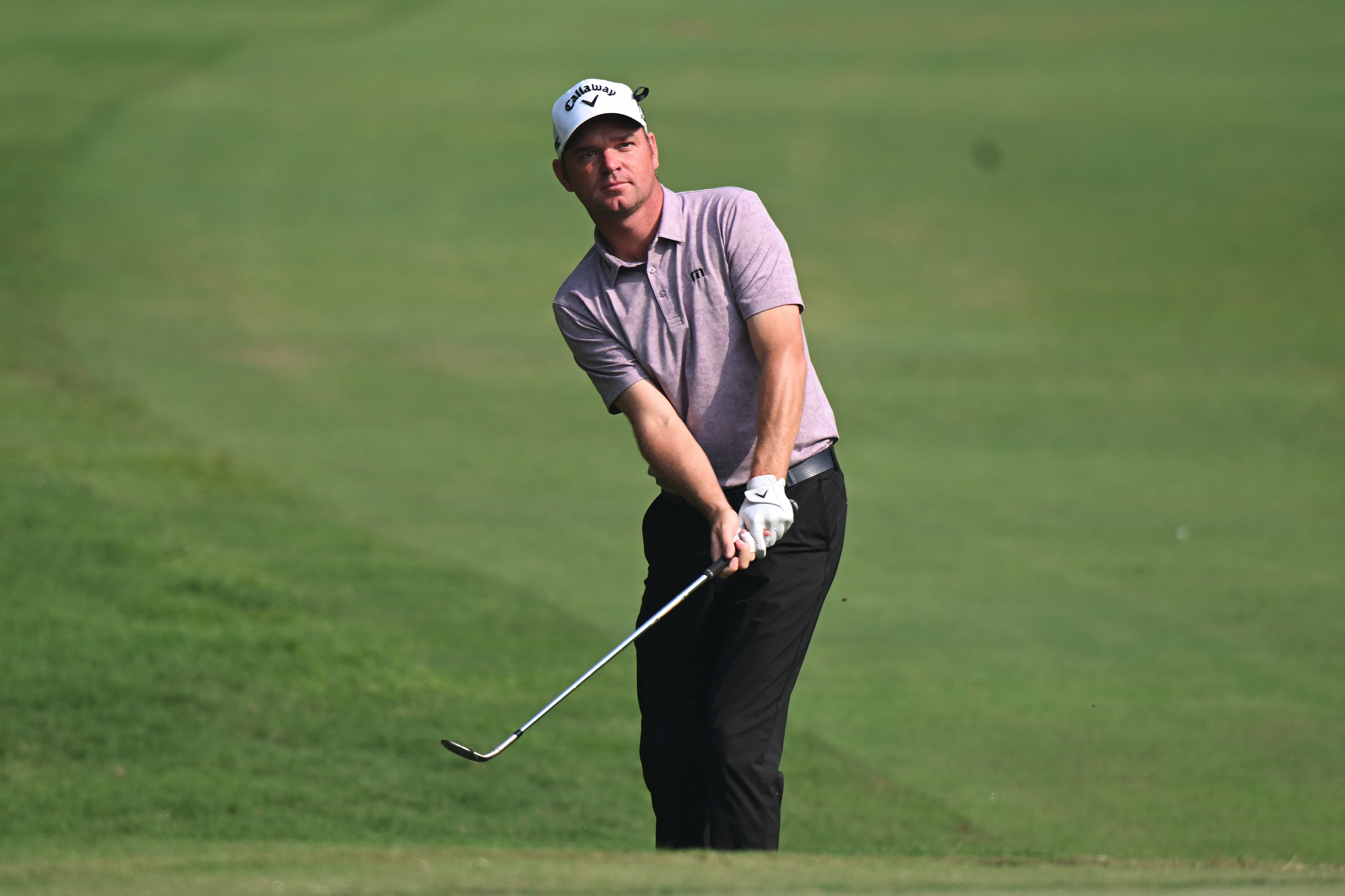 Dale Whitnell hits a chip shot