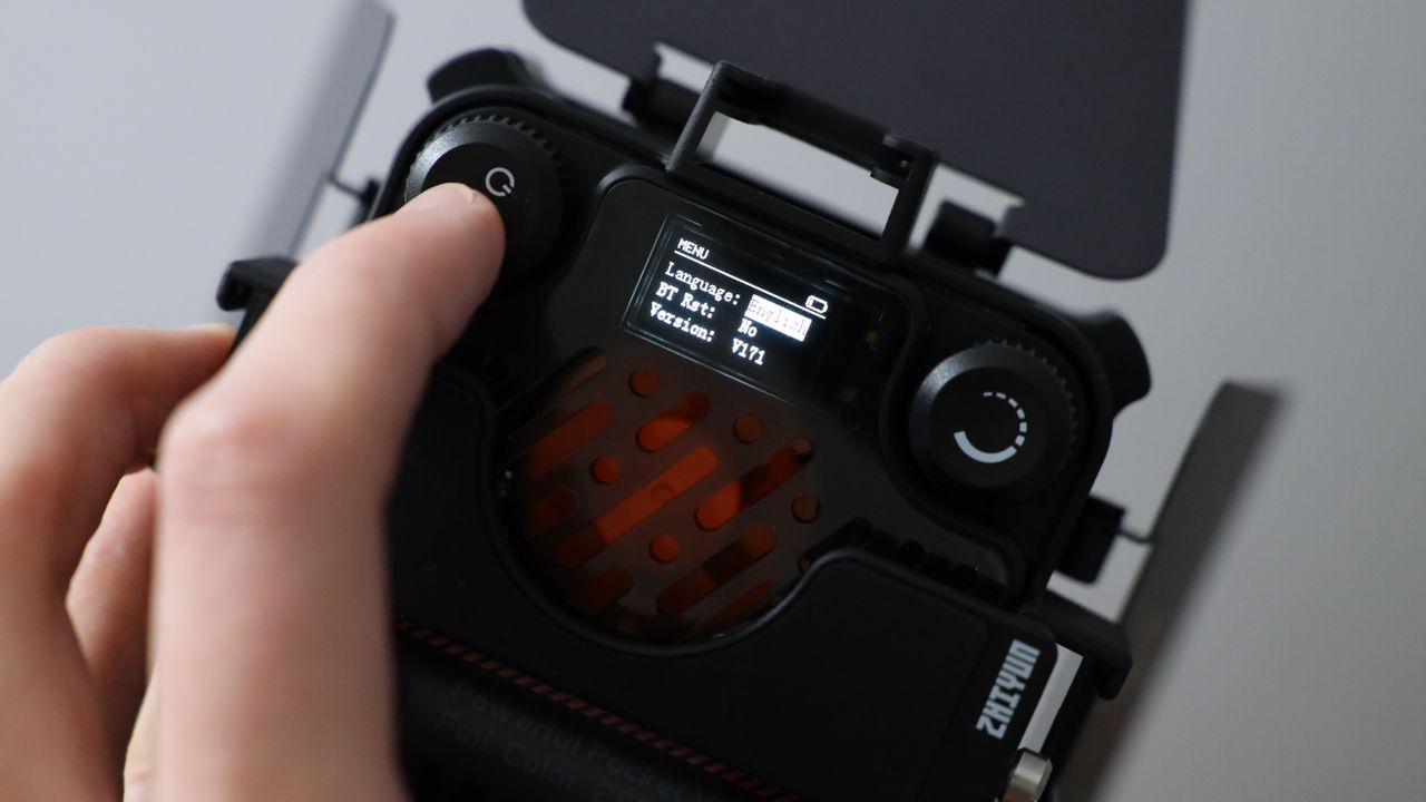 Zhiyun FIVERAY M20C LED panel held in a hand