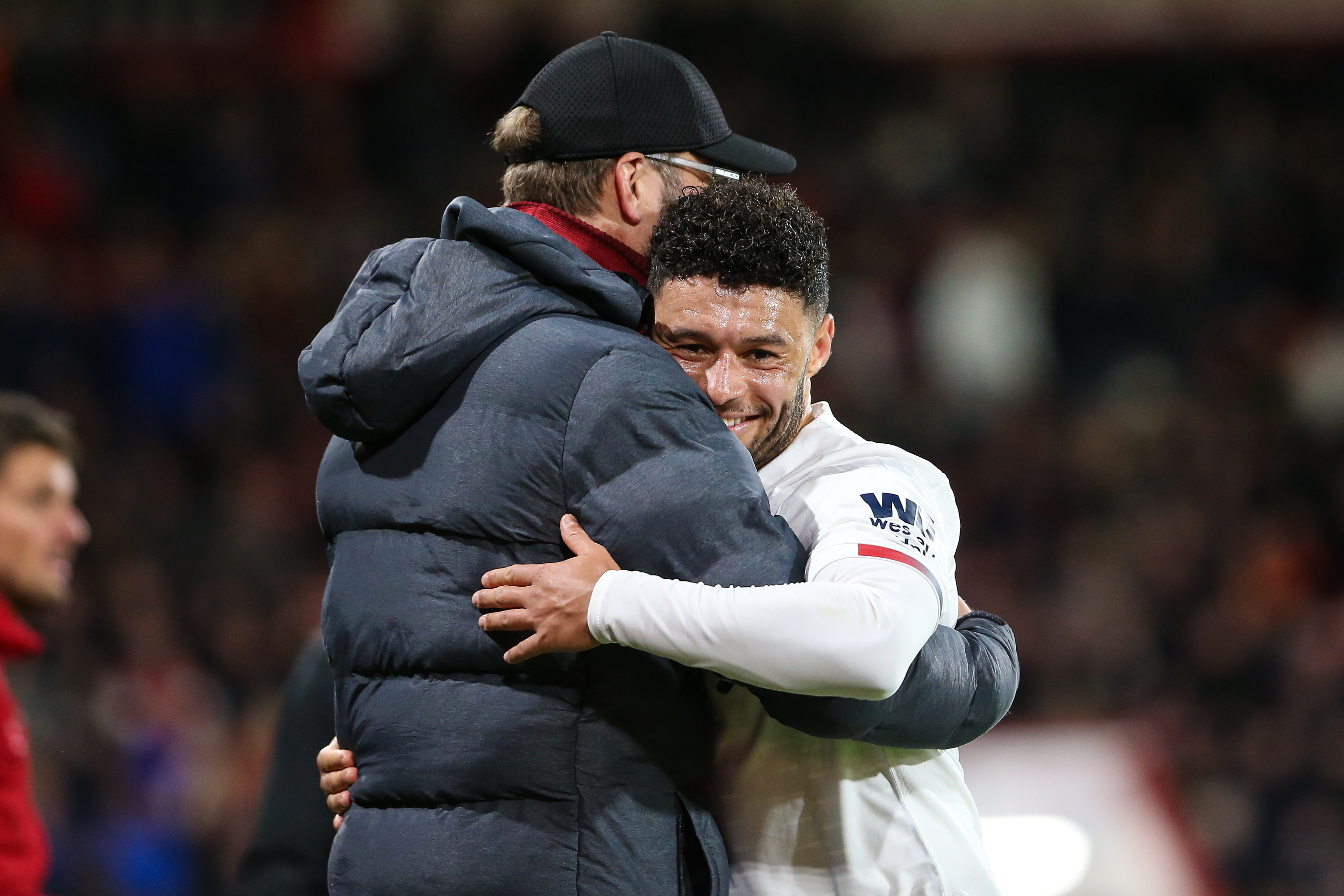 Liverpool manager Jurgen Klopp hugs Alex Oxlade-Chamberlain after substituting the midfielder in a Premier League game against Bournemouth in December 2019.