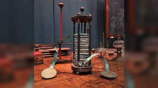 The voltaic pile was the first electrical battery invented by Italian chemist Alessandro Volta in 1799. It's essentially a pile of alternating copper and zinc discs that are separated by cardboard or felt spacers soaked in salt water.