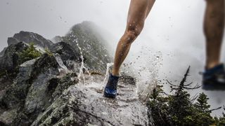 Person running on wet trail