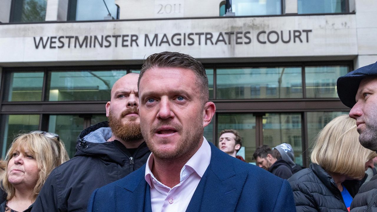 Tommy Robinson standing outside Westminster Magistrates court in London