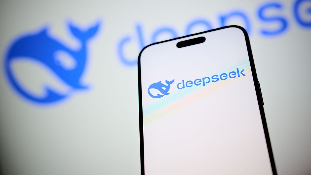 DeepSeek logo and branding pictured on a smartphone screen with company branding in background.