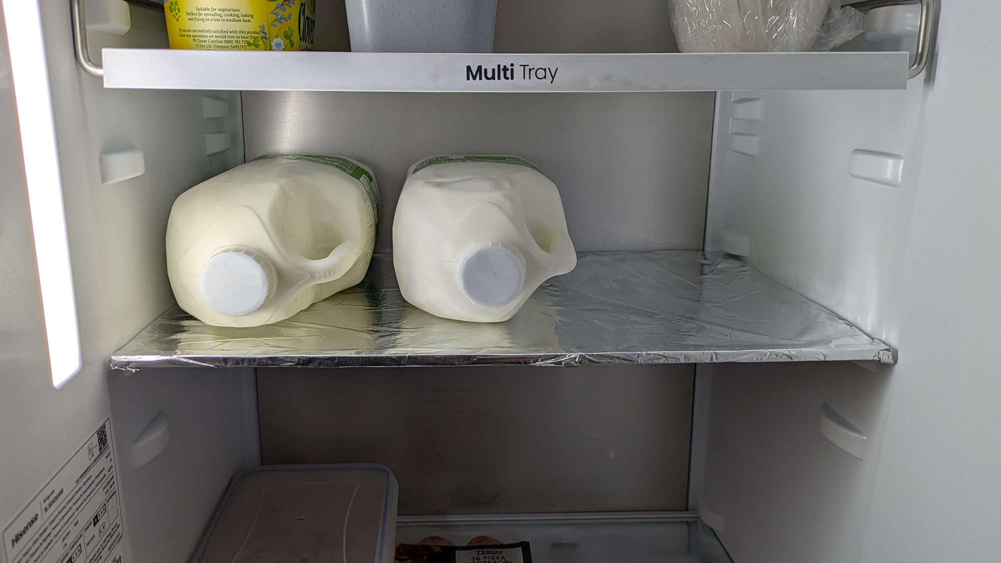 Aluminum foil on shelf in refrigerator