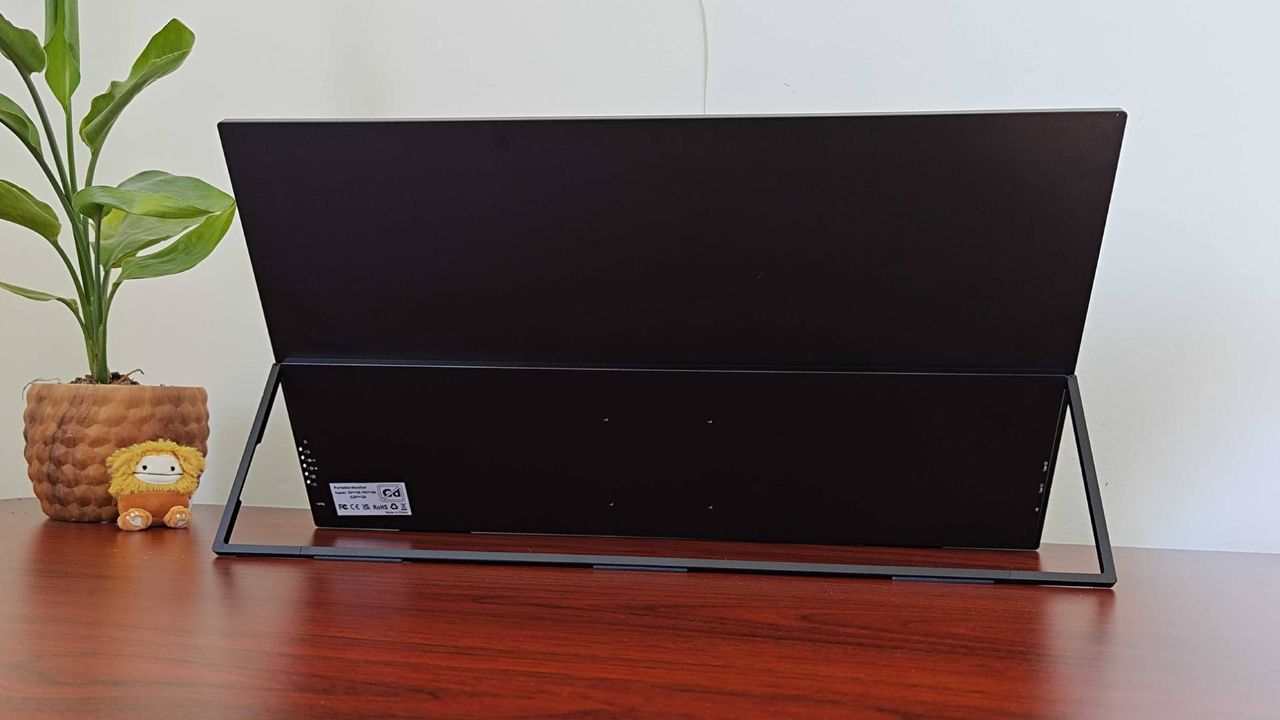 Back view of Uperfect Umax 24 portable monitor on desk with the kickstand flipped out.