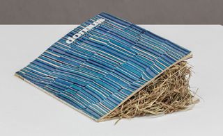 A blue coloured book on white surface
